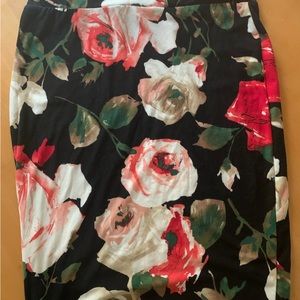 A Black Large Rainbow Skirt With Flowers On It